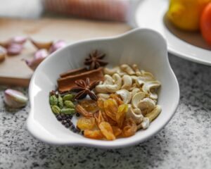A white bowl filled with different types of food